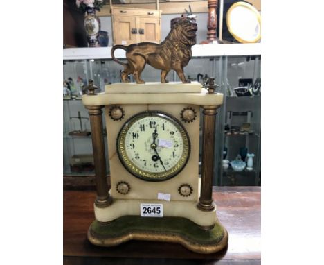 An ornate mantel clock surmounted by a Lion (no pendulum and key)