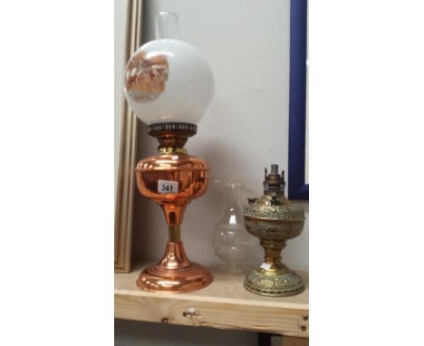 A copper oil lamp and brass oil lamp
