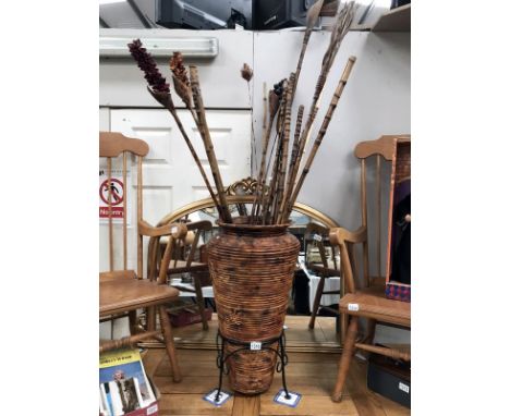 A bamboo walking stick stand with bamboo items