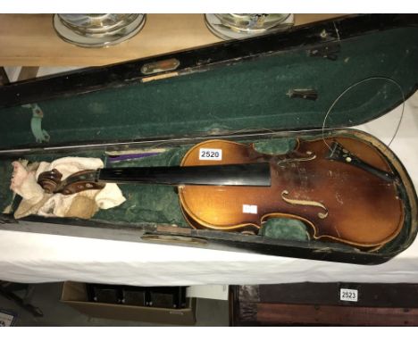 An old violin in wooden case (needs repair). Made in Czechoslovakia, mother of pearl inlay on string holder
