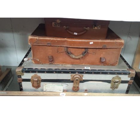 A vintage tin trunk and 2 vintage cases