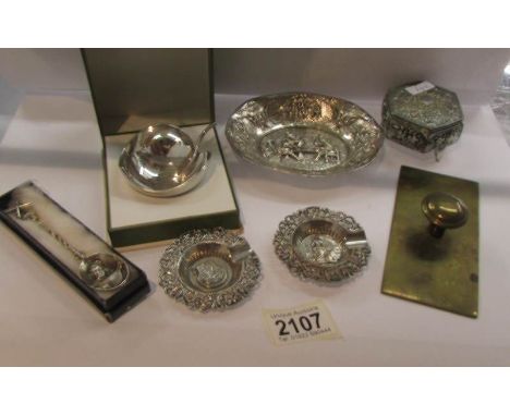 A mixed lot of white metal including trinket box, dishes, windmill spoon etc.,