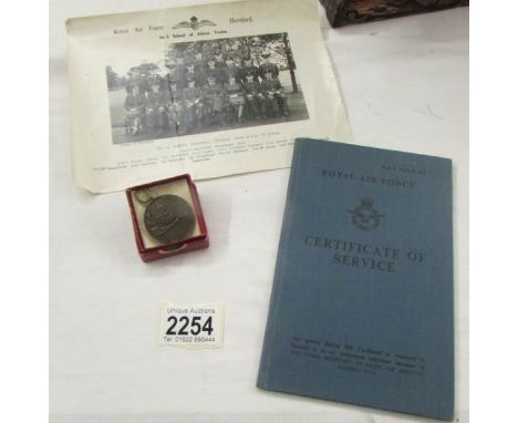 A rare W.R.A.F 1956 Rifle League Medal, an R.A.F Hereford photograph and a certificate of service.