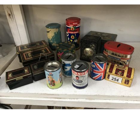 A quantity of vintage tin money boxes including Chad Valley