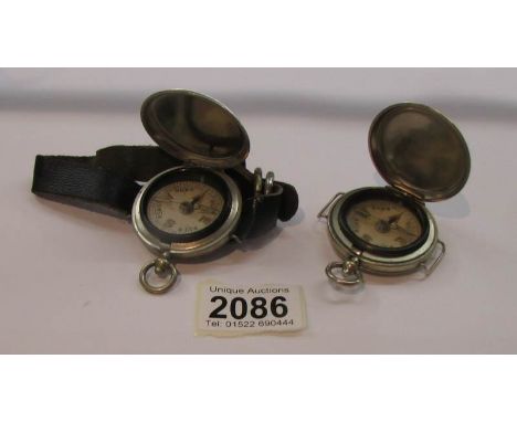An early 20th centre wrist compass and a similar pocket compass.