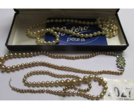 An imitation pearl necklace and 2 others (one a/f).