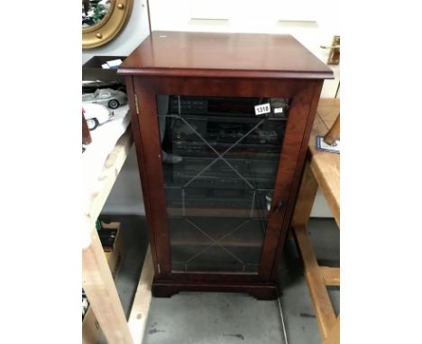 A JVC double cassette deck, stereo amplifier, graphic equalizer and a JVC CD player in cabinet