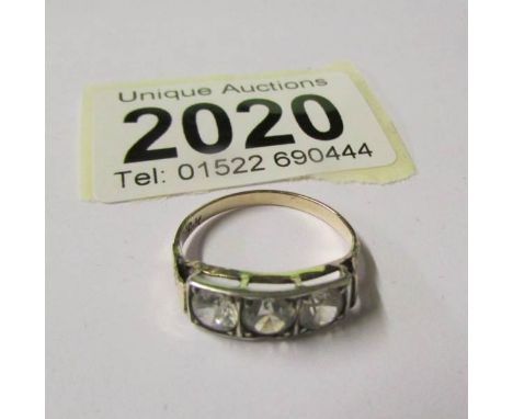 A 3 stone white sapphire 10ct gold ring.