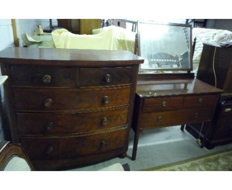 A Victorian Mahogany Bow-Front Chest of Drawers, together with an Edwardian Mahogany Dressing Table (2).