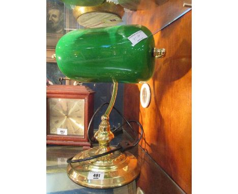 A Brass Bankers Desk Lamp with green glass shade.