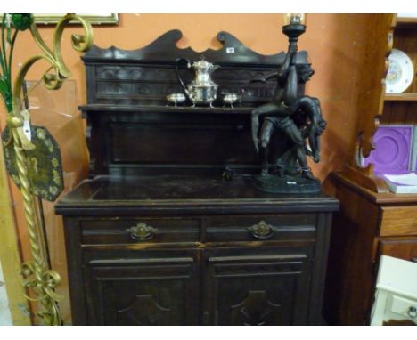 A Mahogany Aesthetics Chiffonier, with triptych and flower head carved shelf back.