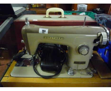 A Vintage Brother Electric Sewing Machine & Cover with foot pedal.