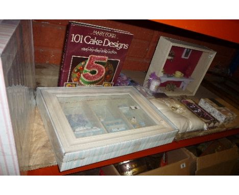 A Shelf of Wedding & New Baby Ephemera to include a miniature Yankee Candle 'Wedding Day', new baby collage pictures, wedding