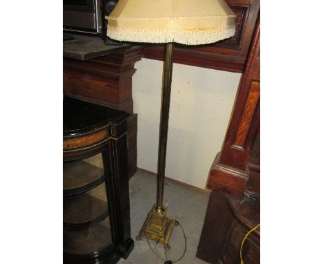 A Brass Standard Lamp & Shade, the Corinthian columnar support on a square stepped base.