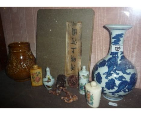 An Erotic Netsuke, two Chinese porcelain vases, two Chinese pendants, an Oriental concertina book, four scent bottles, (11).