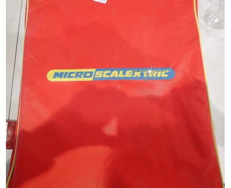 Boxed micro Scalextric track with two cars. P&amp;P Group 2 (£18+VAT for the first lot and £3+VAT for subsequent lots) 