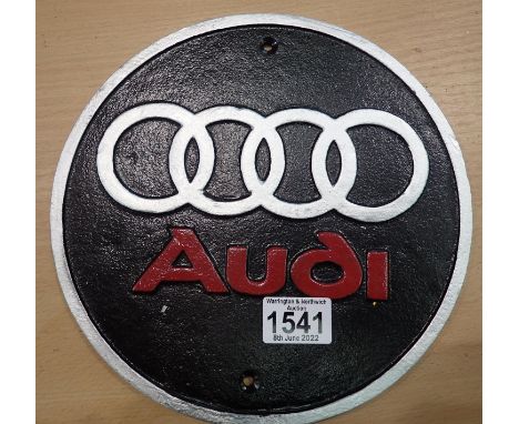 Cast iron circular Audi plaque, D: 18 cm. P&amp;P Group 2 (£18+VAT for the first lot and £3+VAT for subsequent lots) 