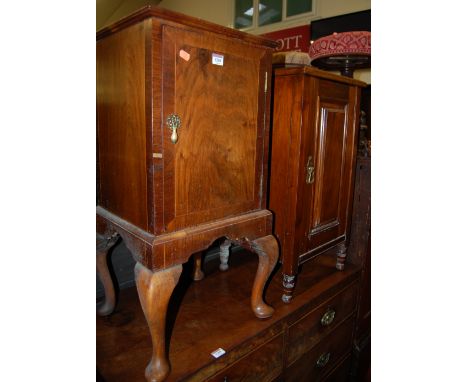 A figured walnut single door bedside cupboard; together with an Edwardian walnut single door bedside cupboard (2)