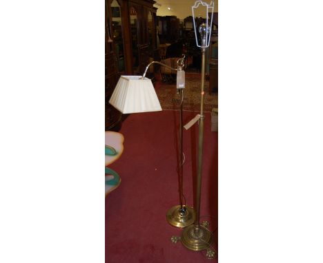 A Victorian brass telescopic standard lamp; together with a contemporary brass standard lamp (2) 