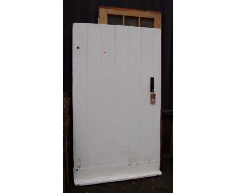 A white painted door, of close panelled construction; together with a pine and part-glazed door (2) 