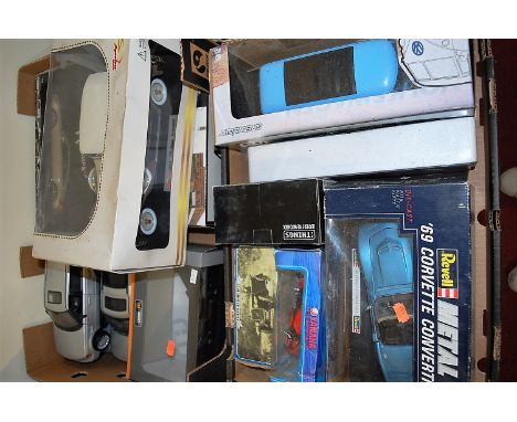 A collection of boxed and loose 1/18 and mixed scale diecast vehicles to inc. Revell 1969 Corvette Convertible