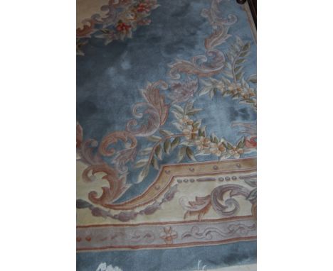 A Chinese superwash blue ground carpet decorated with flowers and foliage, appears in excellent condition, 375x270cm