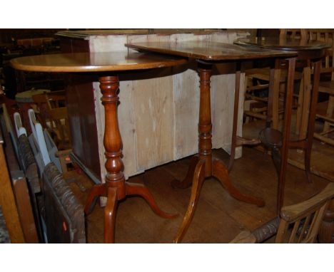 A Victorian mahogany round cornered tilt-top pedestal tripod occasional table; together with a similar oval topped example; a