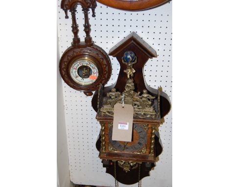 A reproduction Swiss wall clock; together with a small walnut single dial aneroid barometer (2)