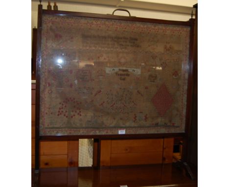An early 20th century mahogany framed fire screen inset, enclosing a 19th century picture and verse sampler by Jane Raper, ag