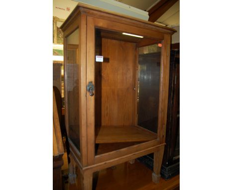 An early 20th century pine single door glazed display cabinet, w.56cm