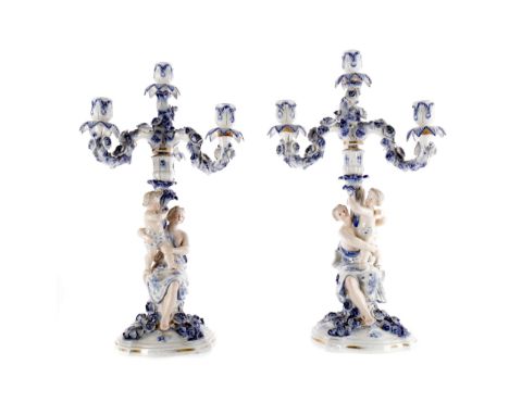 PAIR OF SITZENDORF PORCELAIN CANDELABRA, each central column modelled with a mother and child, with additional three branch s