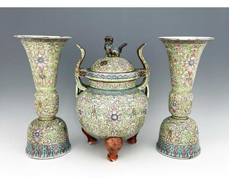 A Chinese altar garniture, Qing, mid 19th century, the central lidded Xian form Ding flanked by two Gu form vases modelled in