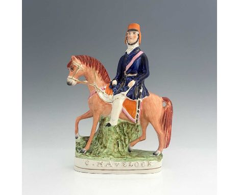 A Staffordshire portrait figure of Sir Henry Havelock on horseback, painted in polychrome enamels with gilded details, mounte