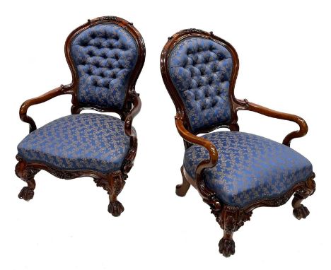 A pair of mid-Victorian rosewood balloon back parlour armchairs, circa 1860, foliate and scroll carved top rails, scroll arms