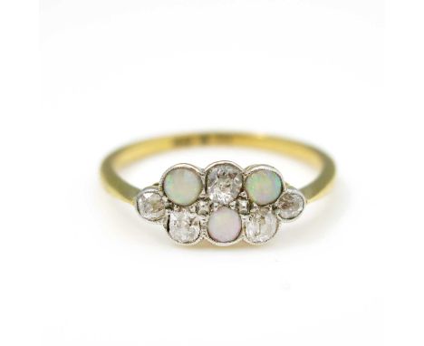 An Edwardian diamond and opal ring, on 18ct gold, pave set with old cut and cabochon stones, size Q, 2.3g