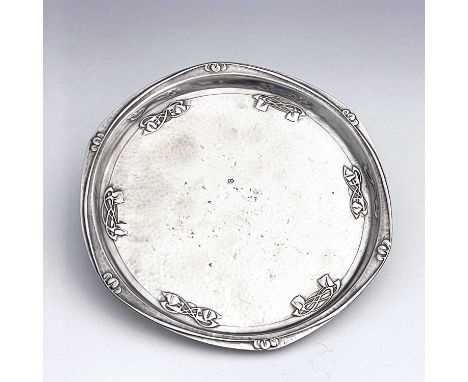 Archibald Knox for Liberty and Co., a Tudric Arts and Crafts pewter tray, model 0716, planished circular form relief moulded 