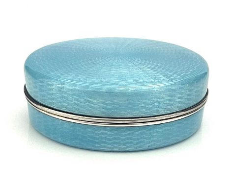 A sterling silver gilt and enamel box, French import marks and makers marks circa 1900, circular form enamelled to all faces 