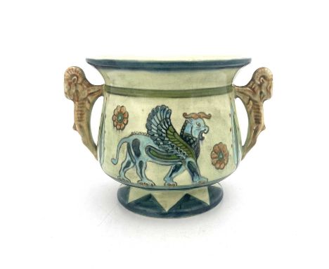 A Sylvac revivalist Assyrian twin handled vase, model 1699, footed form, the handles modelled as rams, painted with winged bu