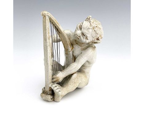 Robert Wallace Martin for Martin Brothers, a stoneware musical imp figure, 1906, modelled playing the harp, cream glazed, inc