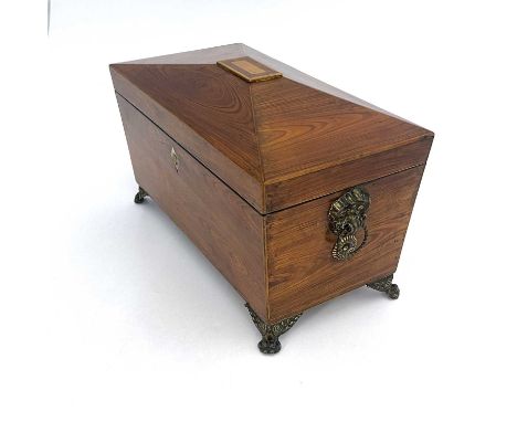 A Regency kingwood and boxwood strung tea caddy, circa 1820, sarcophagus form with two removable hinge lidded caddies and cen