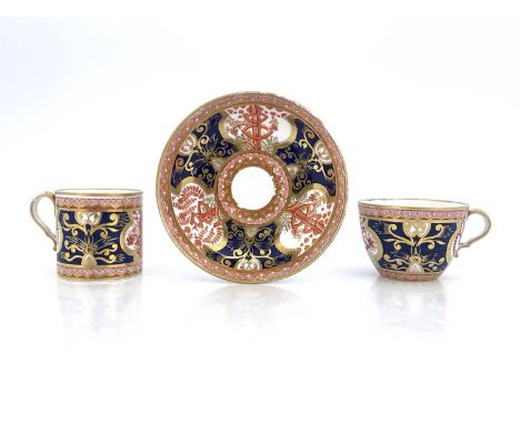 A Spode trio, two cups and saucer, circa 1810, painted in Dollar pattern of iron red, blue and gilt, pattern no. 715, saucer 