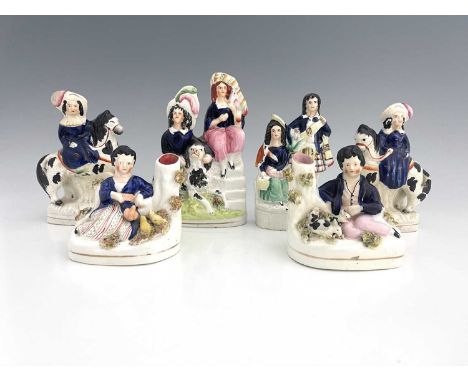 Six Staffordshire royal children figure groups, circa 1860, modelled as a seated girl in cobalt blue and ermine red cloak bes