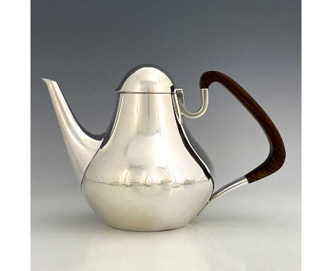 Henning Koppel for George Jensen, a Danish Modernist silver coffee pot, model no.1017, designed 1952, the pear shaped body wi