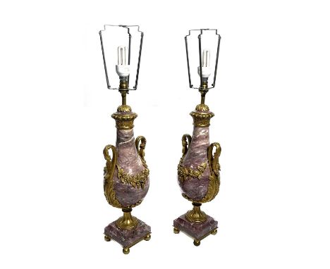 A pair of pink veined marble table lamp bases, of Neo-classical design, ormolu mounts comprising acanthus scroll twin handles