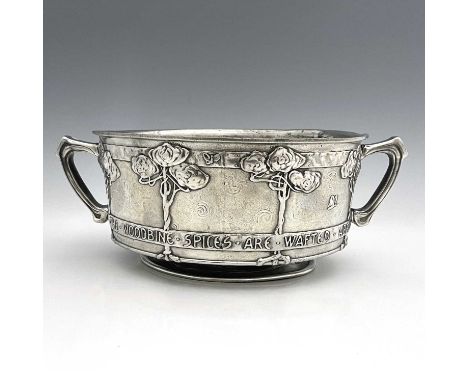 David Veasey for Liberty and Co., an Arts and Crafts Tudric pewter twin handled bowl, model 011, footed drum form, cast with 