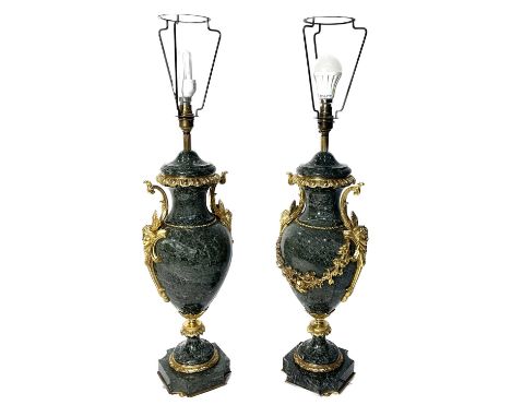 A pair of green-veined marble table lamp bases, of Neo-classical urn design, gilt ormolu mounts comprising mask twin handles 