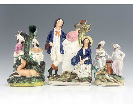 Three Staffordshire spill vases, circa 1830, including two children and a faun in a forest setting, figures are mounted on a 