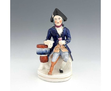 A Staffordshire figure of a Greenwich Hospital pensioner, circa 1850, modelled as a seated sailor with peg leg, dressed in na