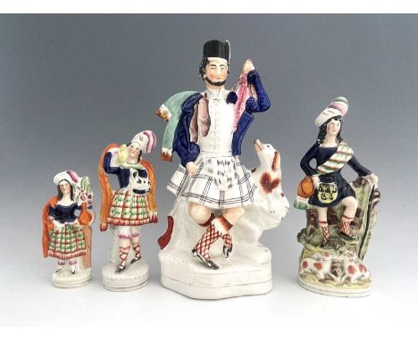Four Staffordshire figure groups, circa 1850, including a shepherd figure holding a crook and pigskin water carrier, modelled