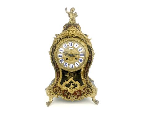 A late 19th Century French boulle work bracket clock, circa 1870, of balloon shape with a cherub finial and Rococo mounts, 12